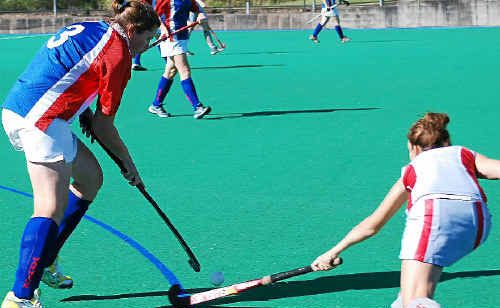 Angela Groves (left) shows her style for Warwick in ladies hockey.